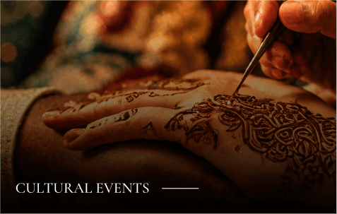 Cultural events: hands being decorated with intricate henna