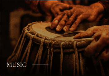Music: a musician playing a traditional hand drum